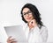 Thoughtful mexican girl holding tablet at office