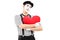 Thoughtful mime artist holding a red heart