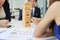 Thoughtful and mindful group of business people playing wooden block tower in office. Risk and strategy business concept