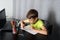 Thoughtful and Prepared: Boy Engaging in Productive Learning at Home