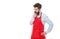 Thoughtful professional business owner shopkeeper thinking business in red apron studio