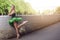 Thoughtful Relaxed Professional Caucasian Ballet Dancer in Green Tutu Dress Posing in Standing Position With Lifted And Stretched