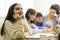 Thoughtful school girl daydreaming, sitting at lesson