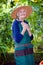 Thoughtful Senior Woman in Garden Hat and Apron