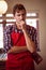 Thoughtful waiter standing at counter