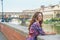 Thoughtful woman on embankment near ponte vecchio