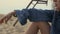 Thoughtful woman relax sitting sand beach near ocean close up. Vacation concept.