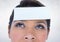 Thoughtful woman with sticky note on her forehead