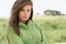 Thoughtful Young Woman Standing On Beach