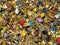 Thousands of padlocks known as love locks adorn the Pont des Arts bridge in Paris, France. Golden padlocks sunny background. Conju