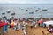 Thousands of people are on the beach offering gifts to Iemanja