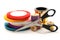 Thread bobbins, scissors and ribbon