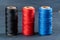 Thread coils black red and blue