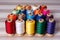 thread spools of different colors arranged by size