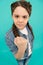 Threatening with fist. Angry child shake fist grey background. Beauty look of child girl. Small child in casual wear