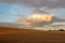 Threatening skies over ripe cornfield