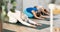 Three active women practice the pose of a child