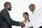 Three african business people handshake