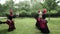 Three african women dancing a folk dance in traditional costumes with wicker baskets