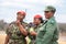 Three african women officer in red beret and green uniform of Umbutfo Swaziland Defence Force USDF