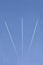 Three aircrafts in the ski make a graphic sign with condensation trails with copy space for your text