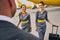 Three aircrew members standing at the airdrome