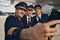 Three airmen in uniforms taking selfies at the airport