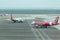 Three airplanes airline Airasia go to the taxiway at the airport. Airport daily routine.