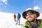 Three alpinists friends walking climbing ice glacier mountain An