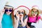 Three amazed girls with passports