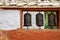 Three ancient religious Buddhist prayer drums on the street.