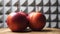 Three apples on a rotating wooden table, close-up video. Red apples side view. Fruits on a gray background