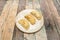 Three Argentinian chicken empanadas on a white plate