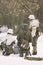 Three armed soldiers of the Wehrmacht in the winter camouflage