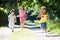 Three Asian Children Enjoying Walk In Countryside