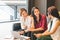 Three Asian girls chatting on sofa at cafe or coffee shop together. Gossip talks, Casual lifestyle with gadget technology concept