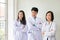 Three asian medical workers Smile. Portrait of asian doctor. Chemists doing in the laboratory. young scientists with test and