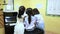 Three asian school girls play piano in the study room