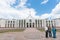 Three Asian tourists outside Australian Parliament House in Canberra.