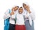 three asian in veils in school uniforms stand smiling with affectionate gestures of each other while carrying backpacks