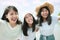 Three asian younger woman and teen happiness on sea beach