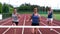 Three athletes running towards the finish line