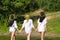 three attractive women out of the water in the shirt