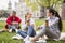 Three bachelor students enjoying coffee break together