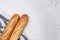 Three baguettes on the wooden background