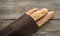 Three baguettes on the wooden background