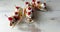 Three banana split sundaes on a faded white background, close up view from the top. Copy space.