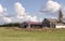 Three barns and field in rural Oregon.