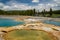 Three beautiful, colorful hot springs geothermal features in Biscuit Basin area of Yellowstone National Park