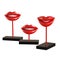 Three beautiful decorative figurines of lips with white teeth on an isolated background.3d rendering